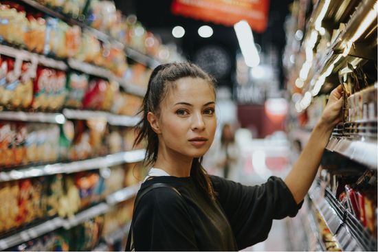 Woman browsing products in shop