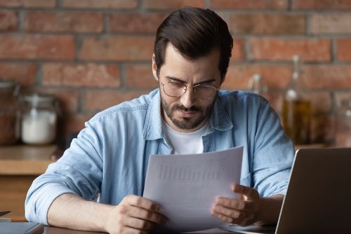 Man reading a worrying letter