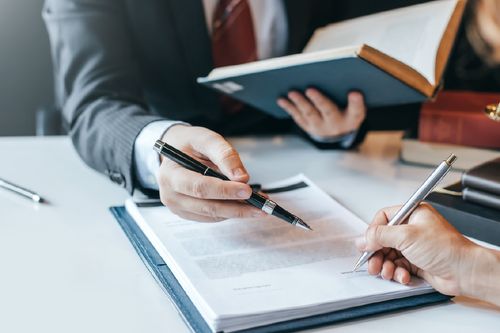 Solicitors reviewing legal books